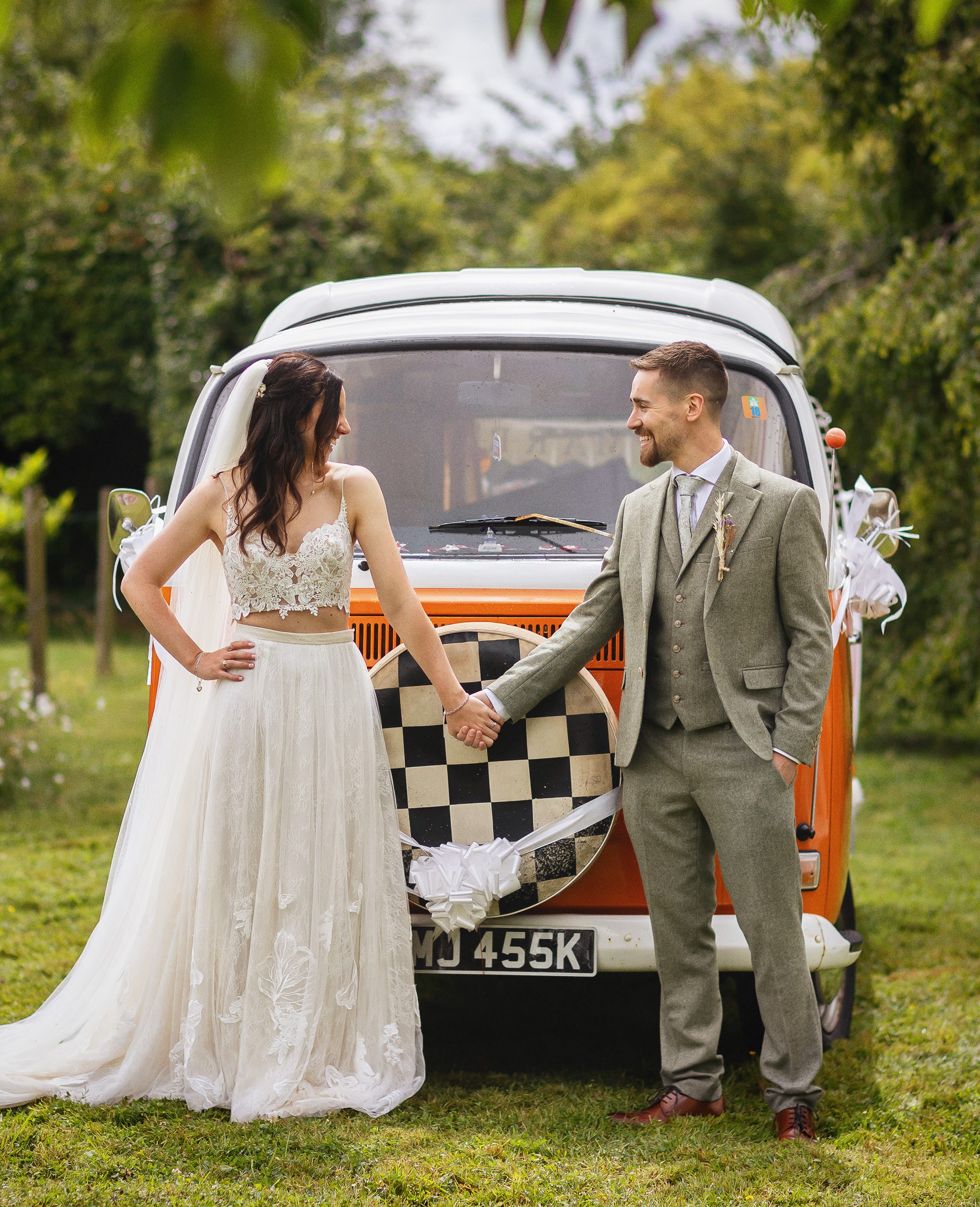 Bride and groom in front of VW Camper Van