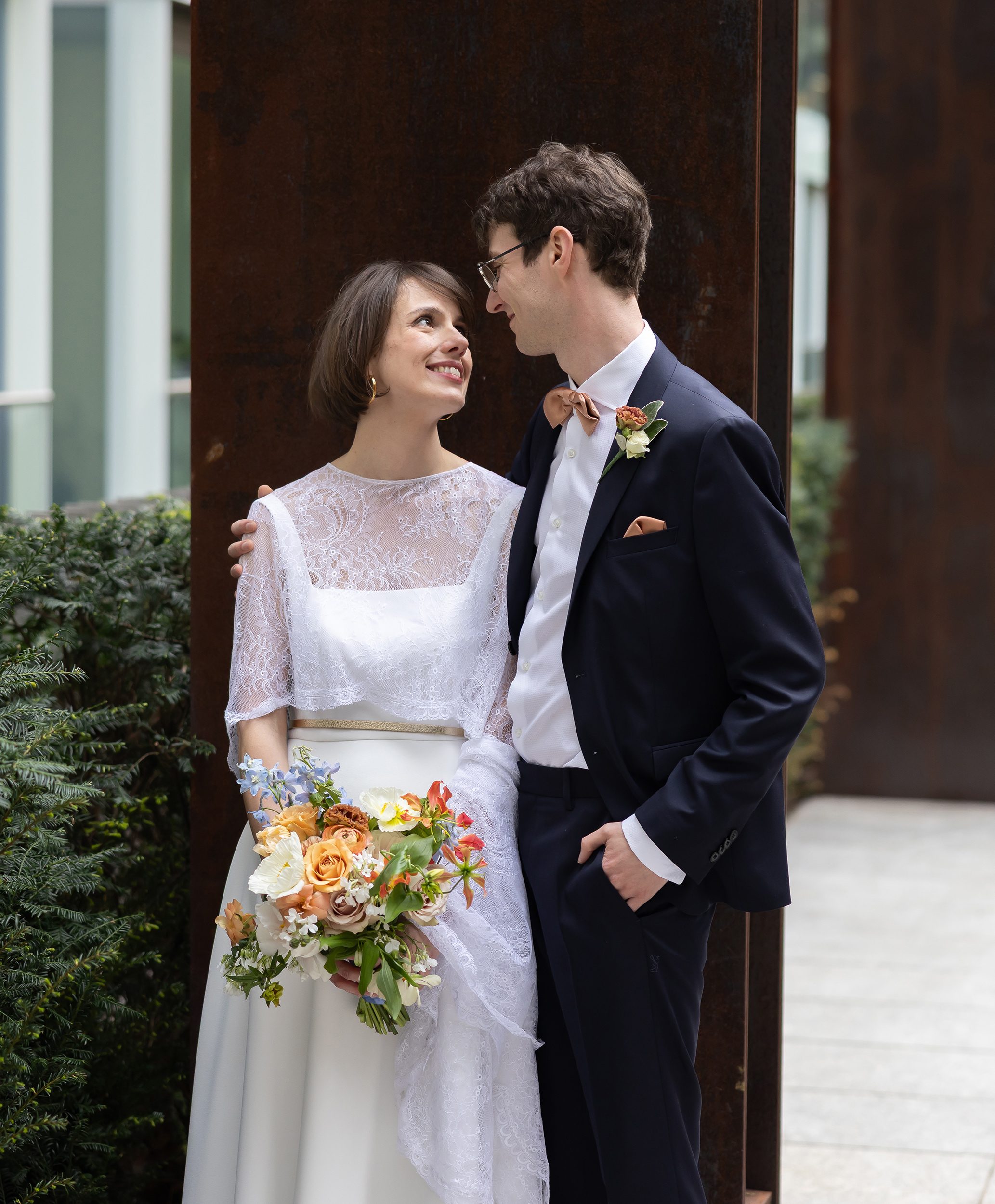 Bride and groom look at each other in Fitzrovia London
