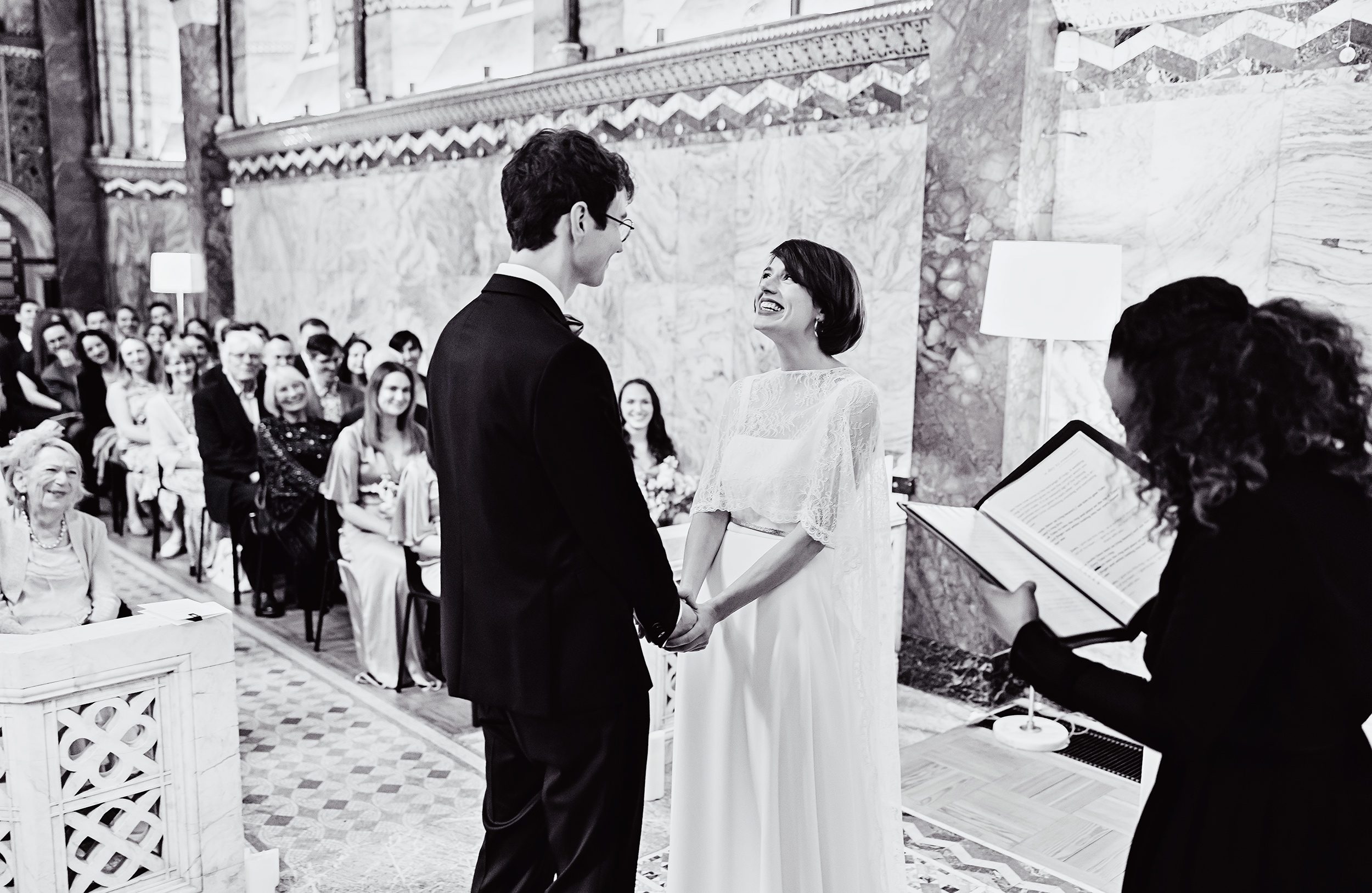 Bride and groom smiling during Fitzrovia Chapel wedding ceremony