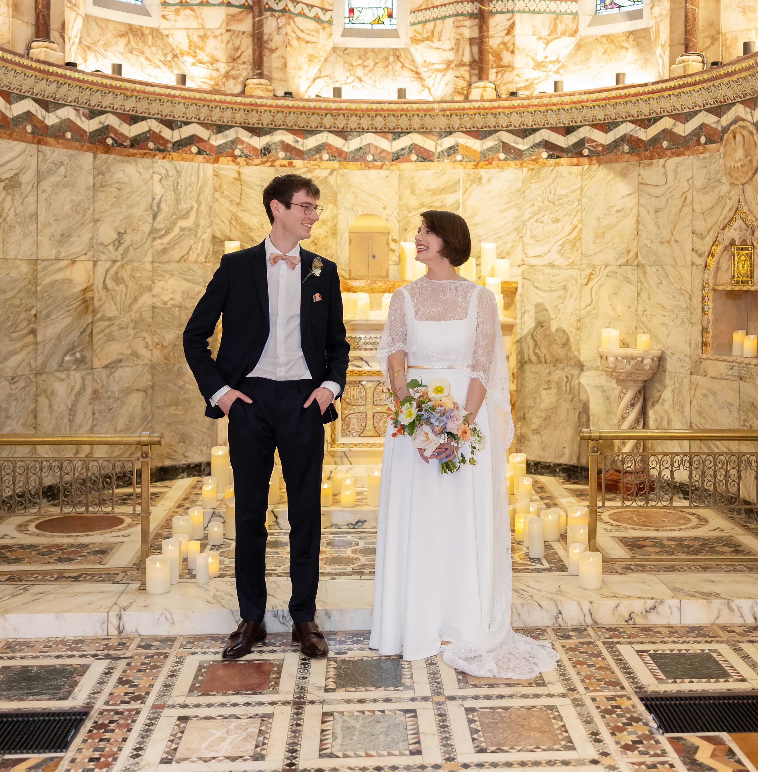 Bride and groom stood inside Fitzrovia Chapel after wedding closer