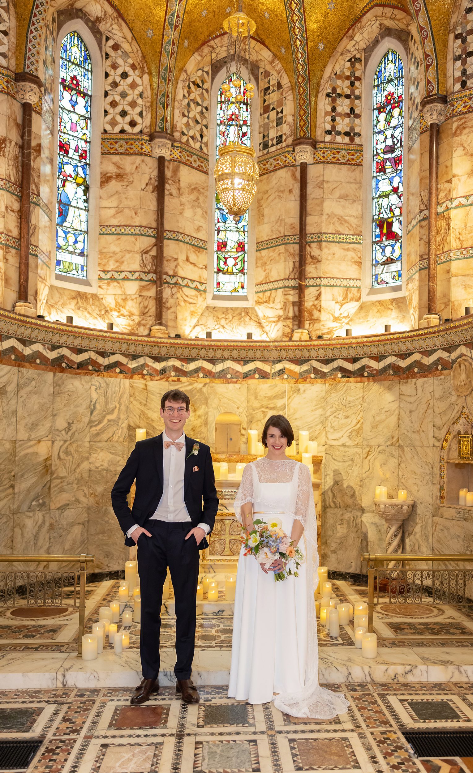 Bride and groom stood inside Fitzrovia Chapel after wedding