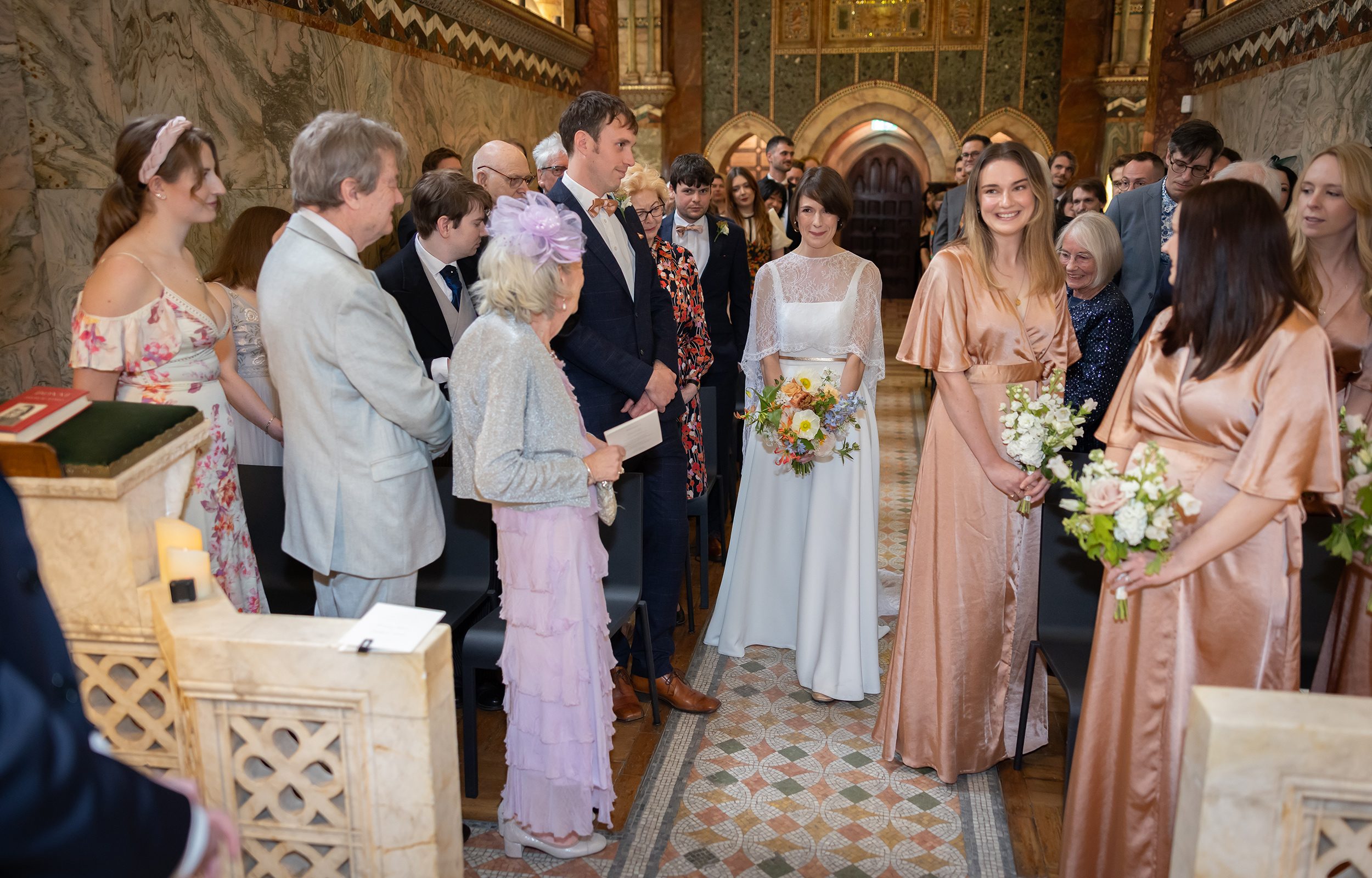 Bride arrives down aisle Fitzrovia Chapel wedding ceremony