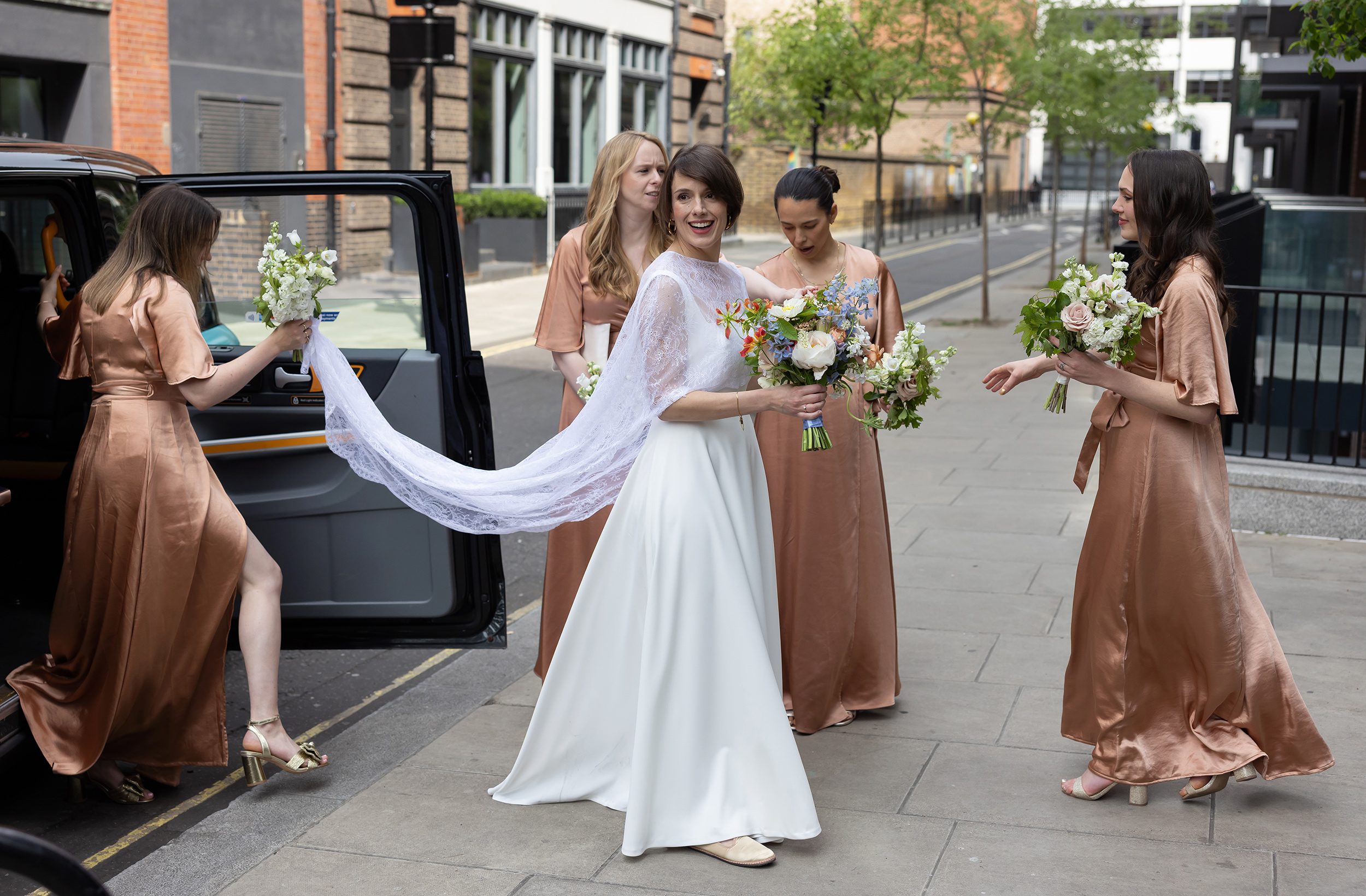 Brides arrival by taxi at Fitzrovia Chapel wedding