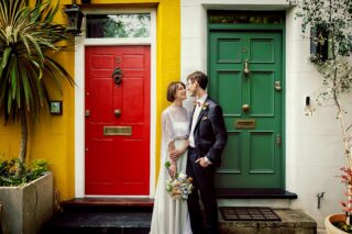 Fitzrovia London wedding couple in front of colourful doors