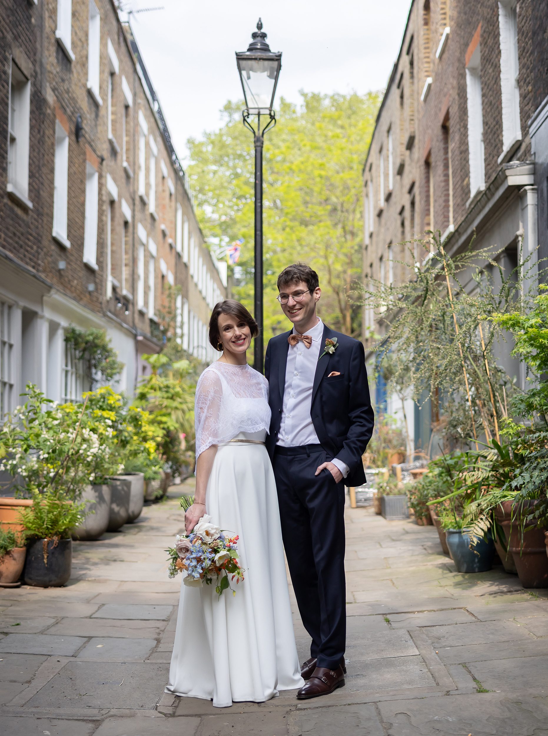 Fitzrovia wedding couple by Victorian lamp post