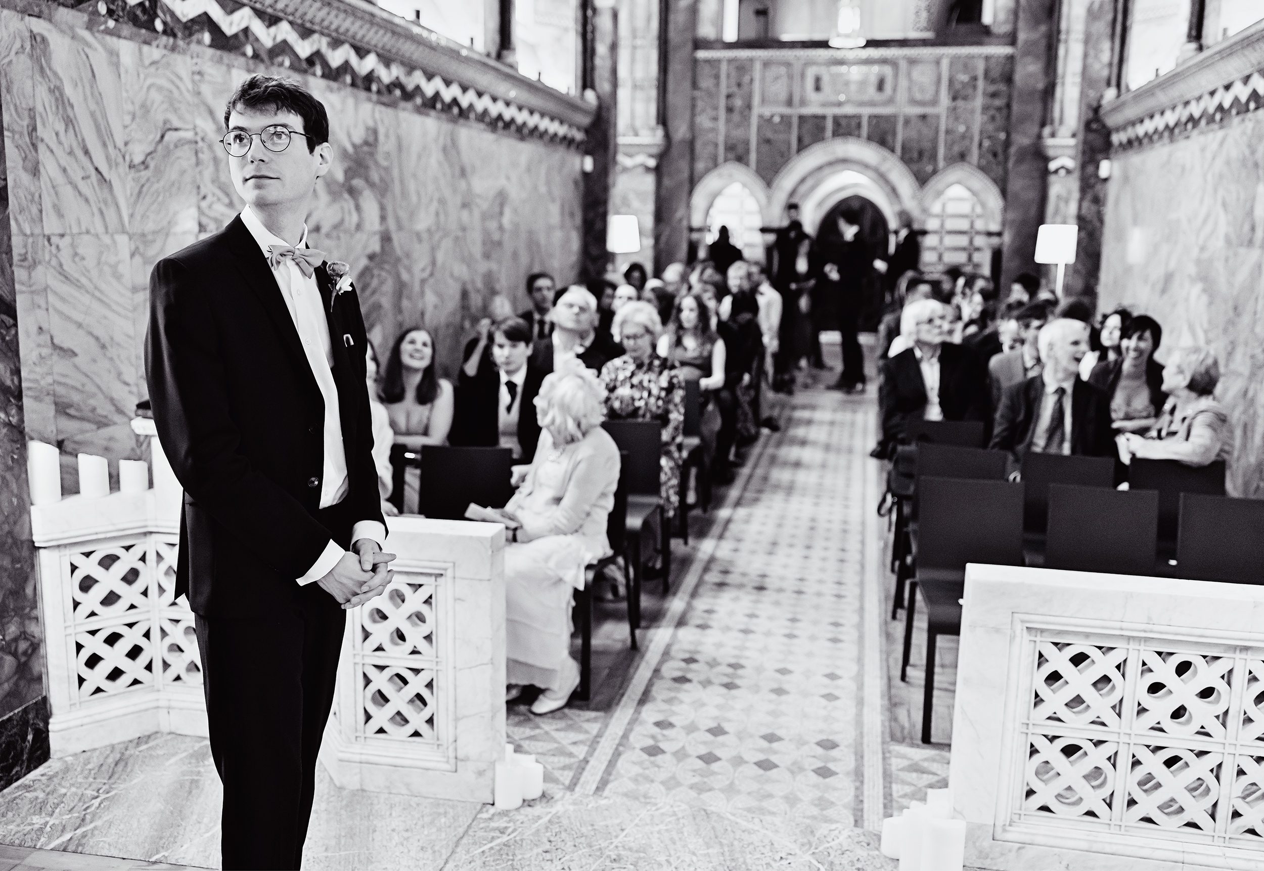 Groom waits with wedding congregation at Fitzrovia Chapel