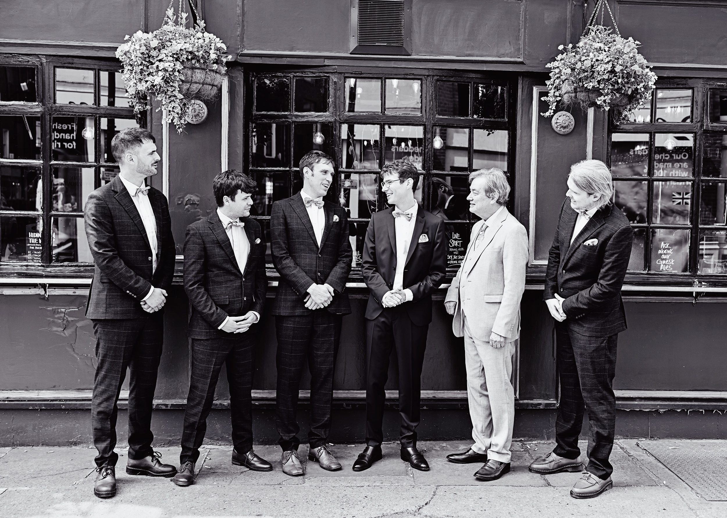 Groomsmen together on Charlotte Street Fitzrovia wedding morning