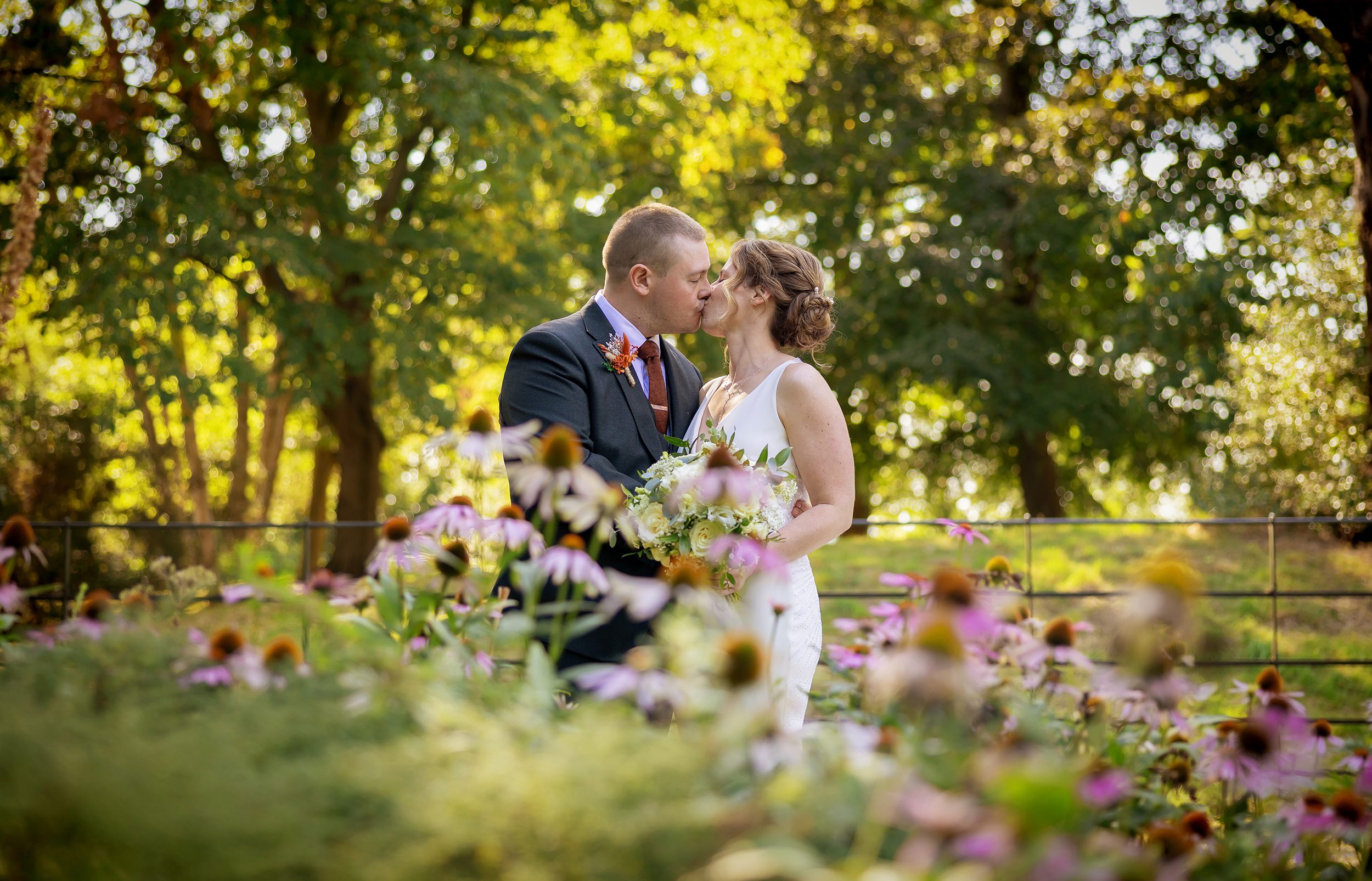 Bride and groom kiss in the gardens Pembroke Lodge Wedding day