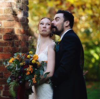 Bride and groom pulling faces Tudor Barn Wedding