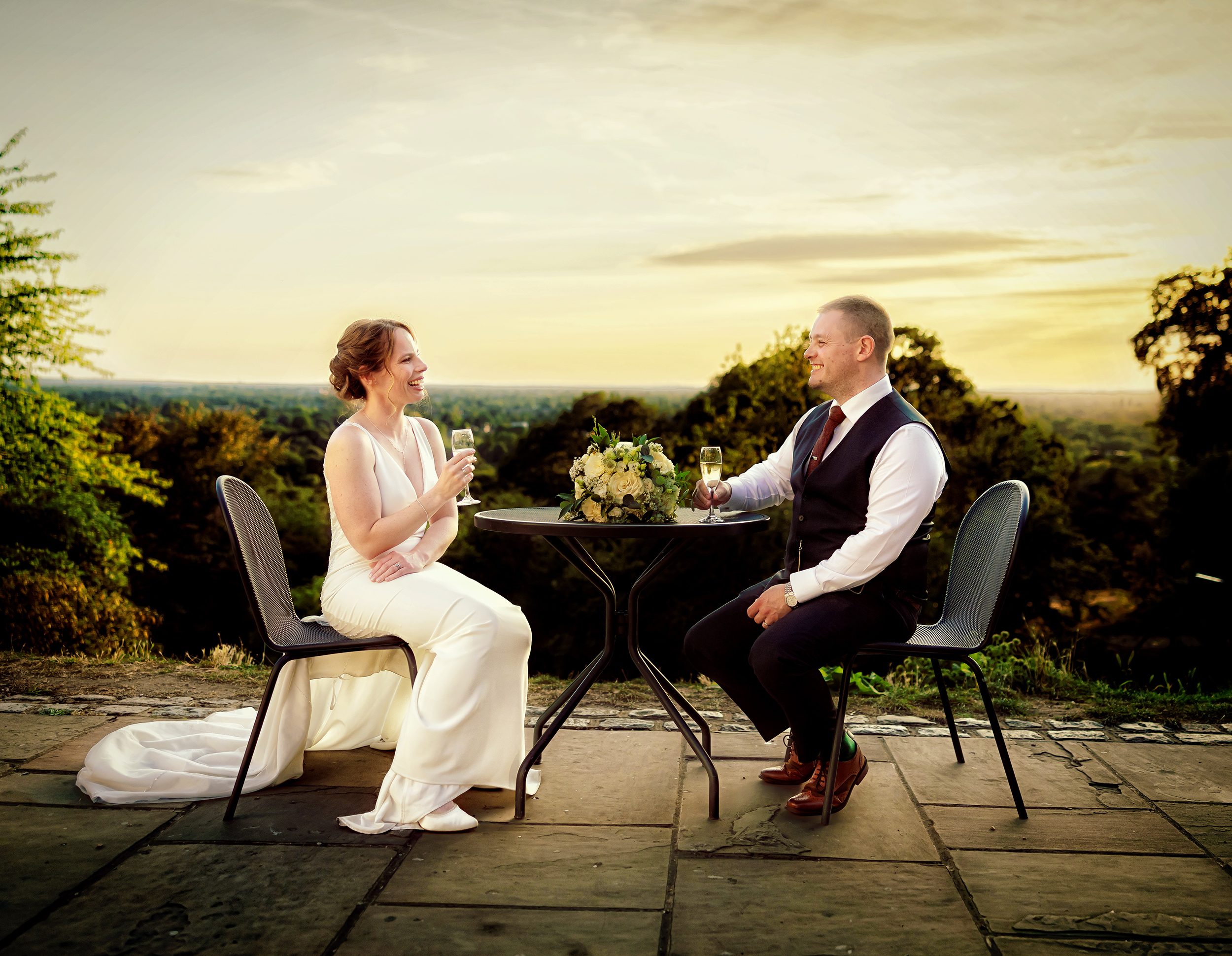 Bride and groom sat together at sunset after Pembroke Lodge Wedding