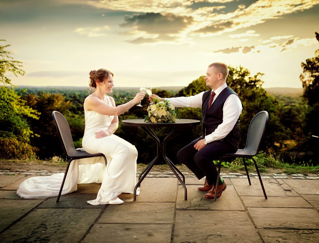 Bride and groom toast each other after Pembroke Lodge Wedding