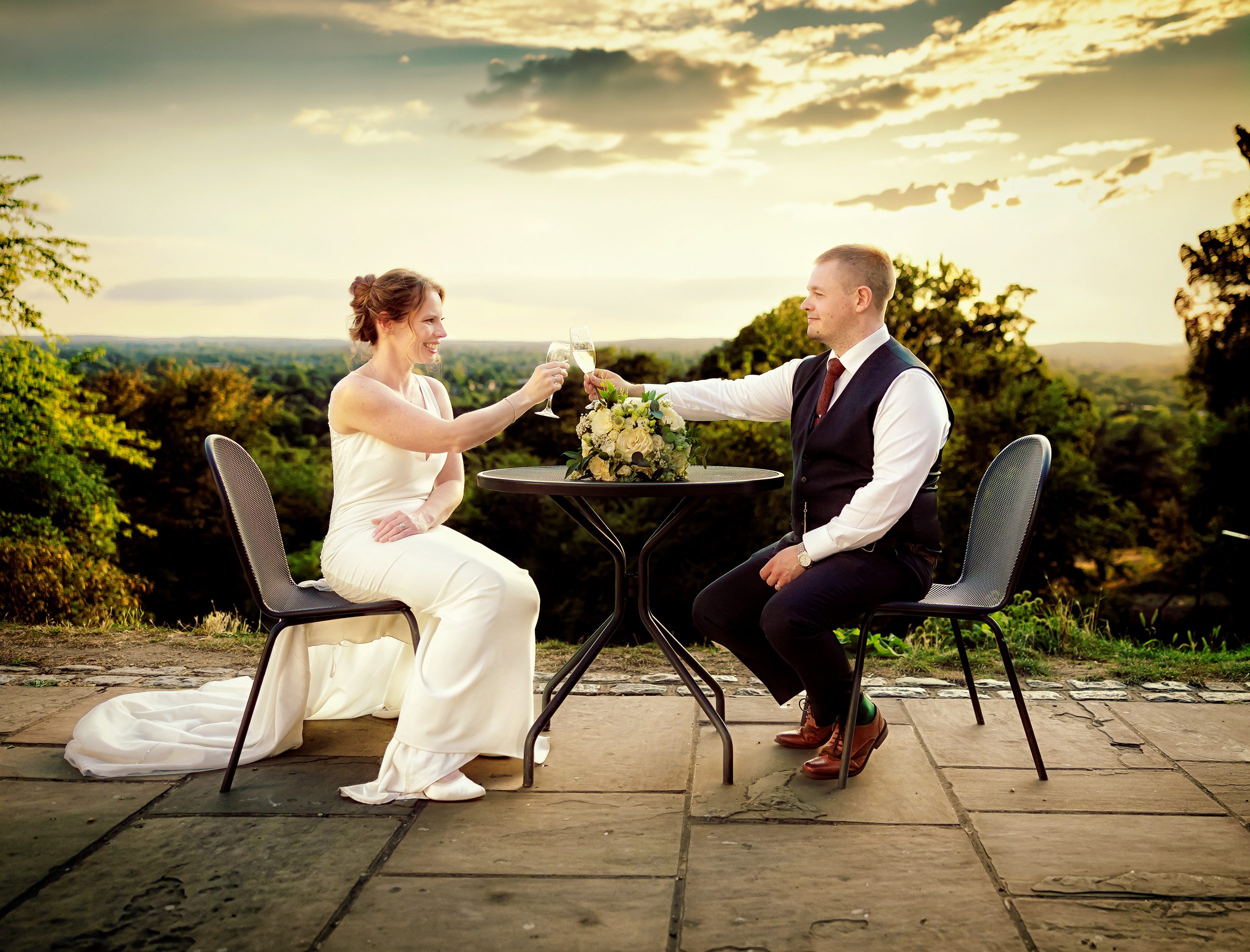Bride and groom toast each other after Pembroke Lodge Wedding