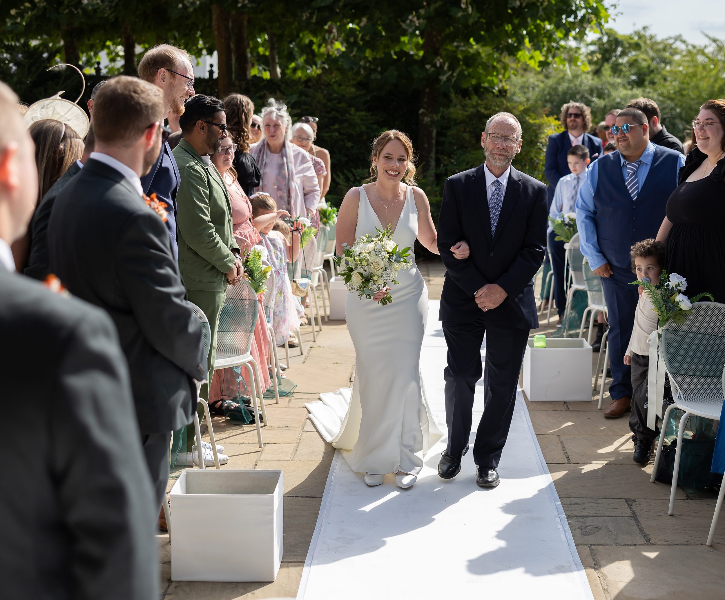 Bride in aisle outdoor ceremony Pembroke Lodge Wedding