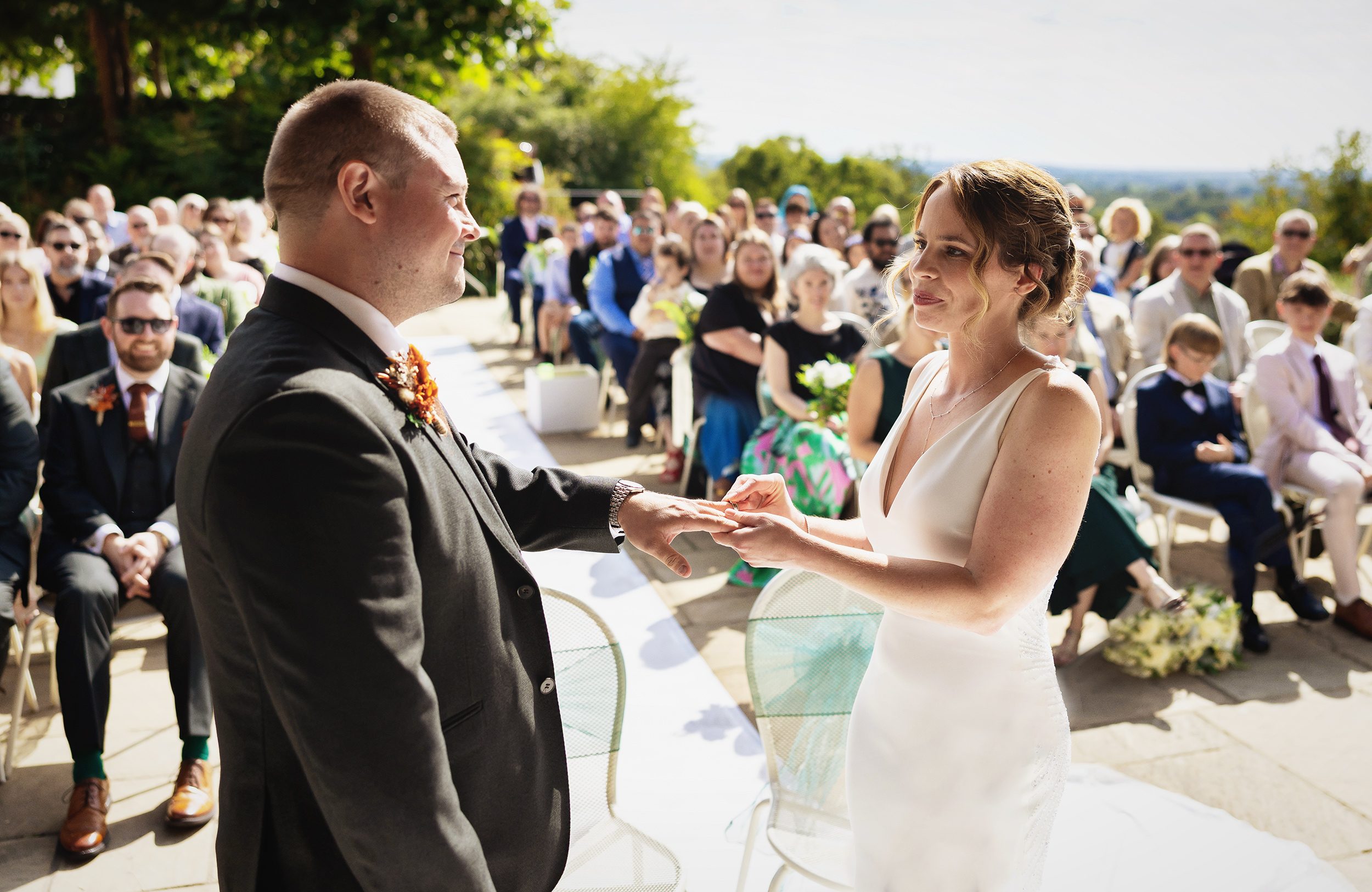 Exchange of rings Pembroke Lodge Wedding Ceremony outdoors