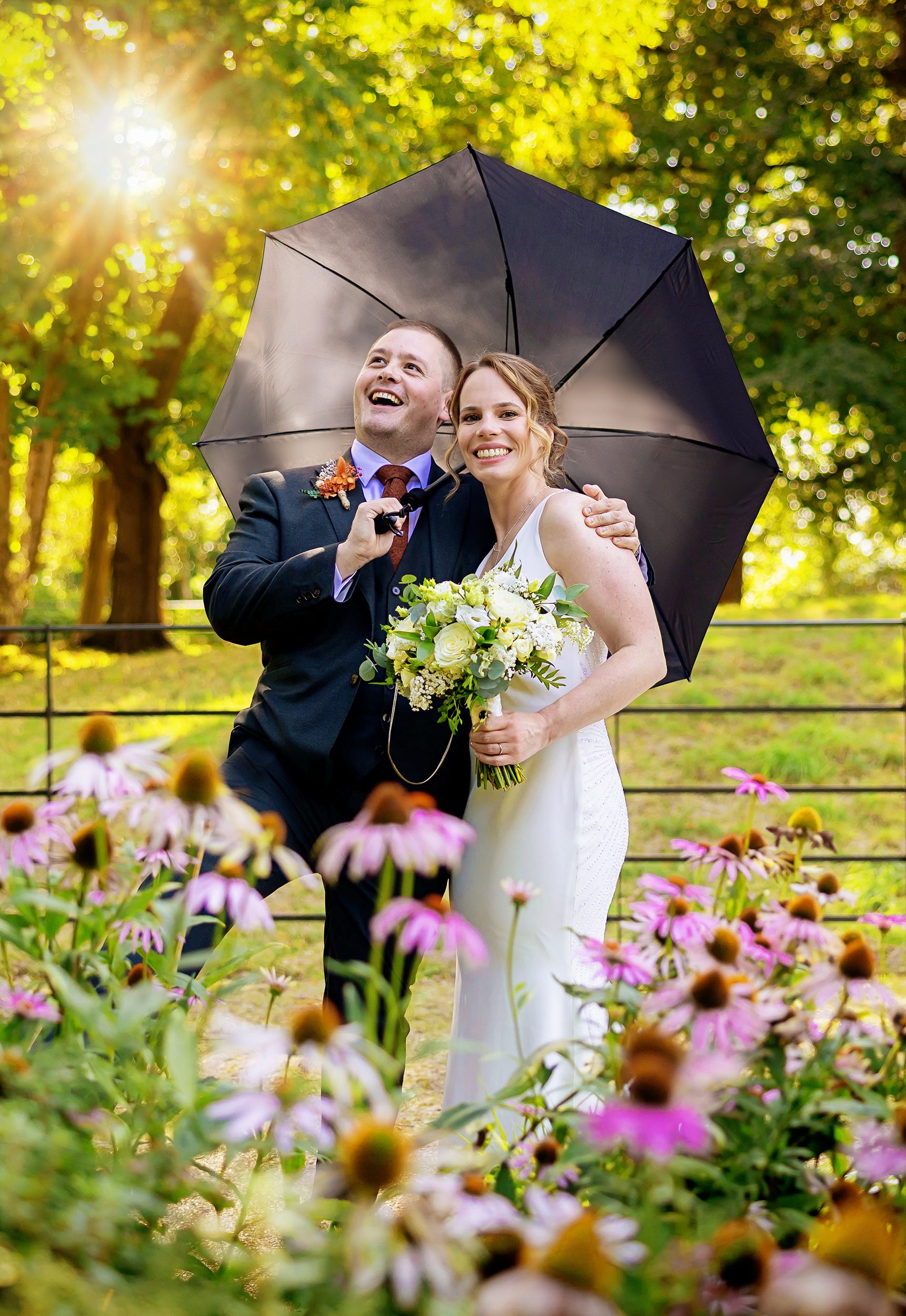 Pembroke Lodge Wedding Photographer bride and groom with umbrella 1