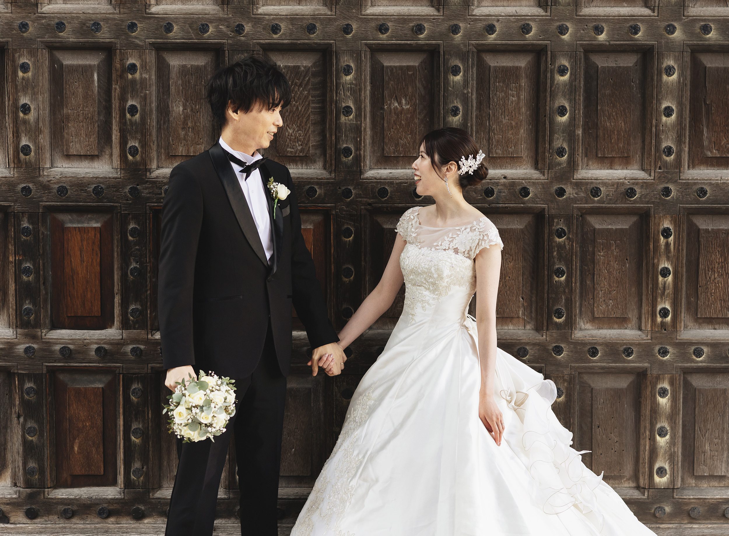 Bride and groom in front of old gates St Pauls London