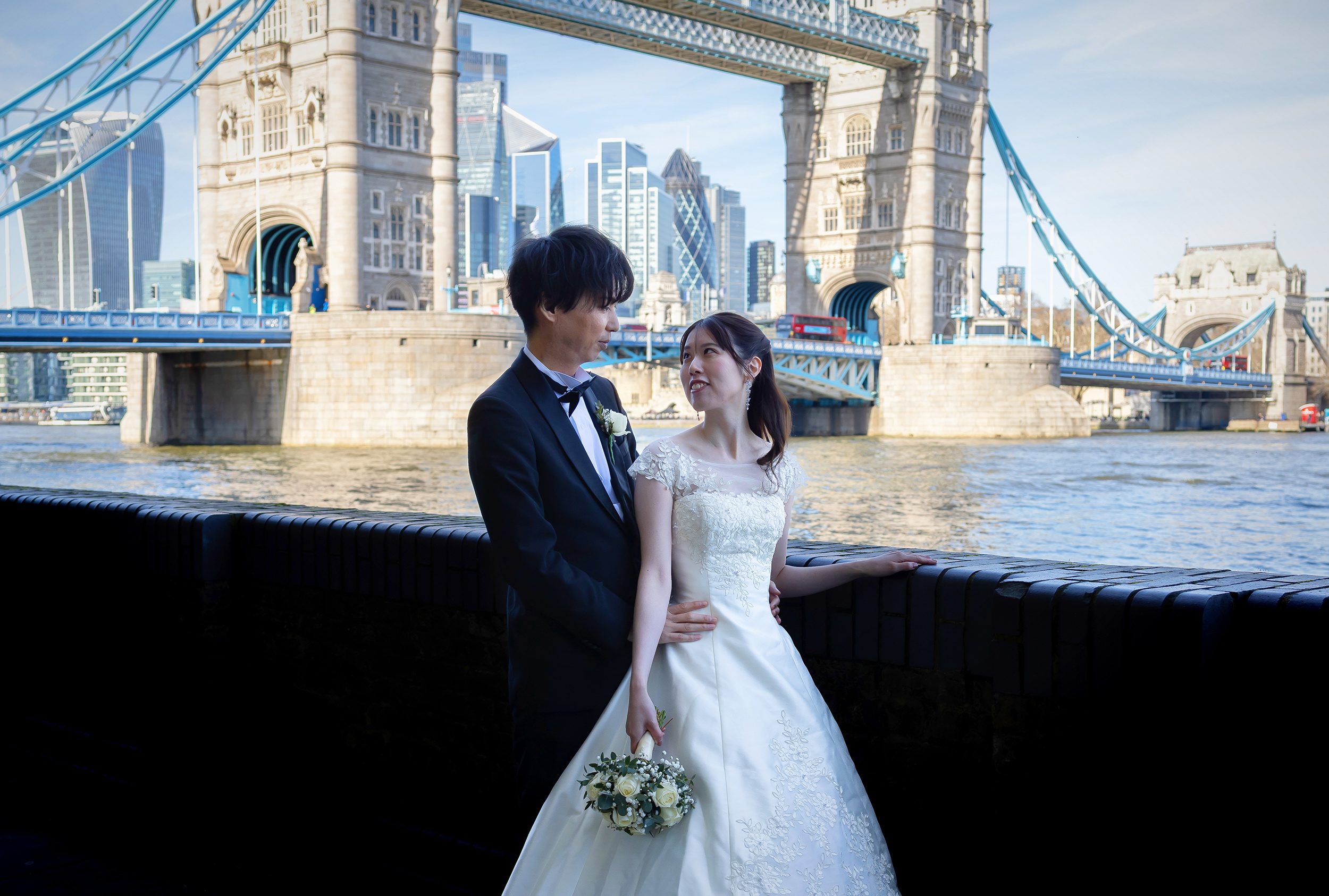 Bride and groom together by Tower Bridge London