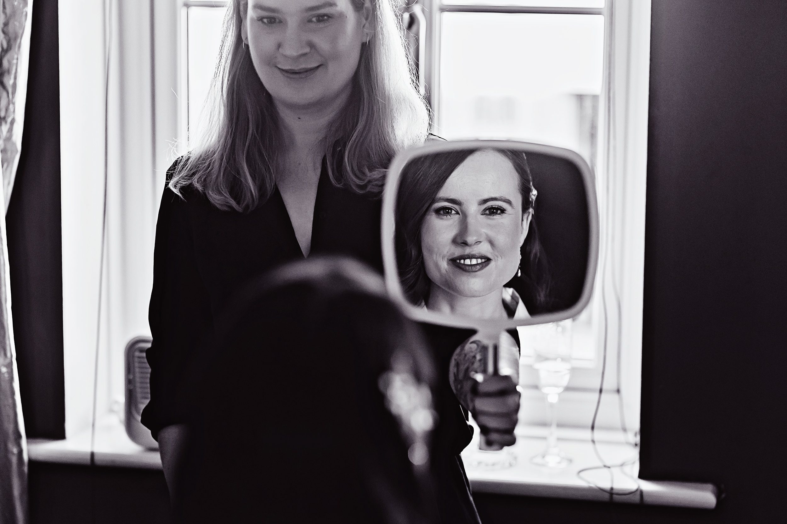 Bride in mirror Islington wedding morning prep image